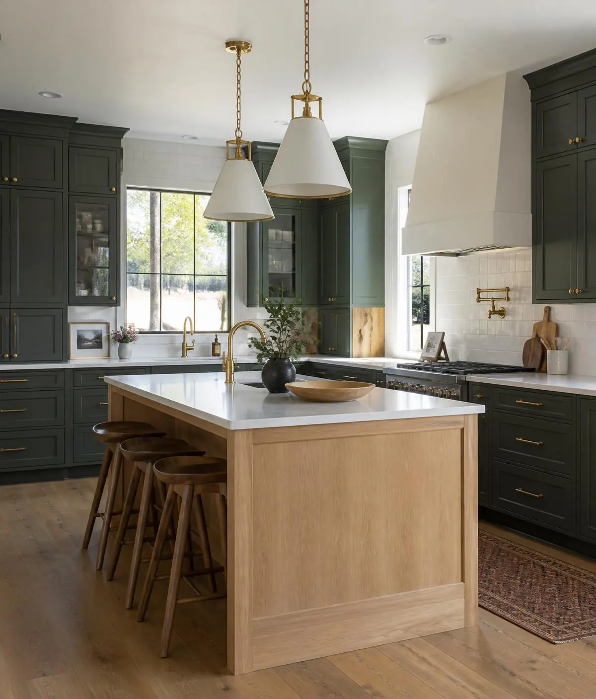 Modern craftsman kitchen with deep green cabinetry and white oak island